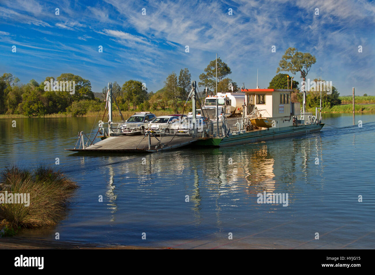 Vehicular ferry carrying cars and truck across Clarence River with