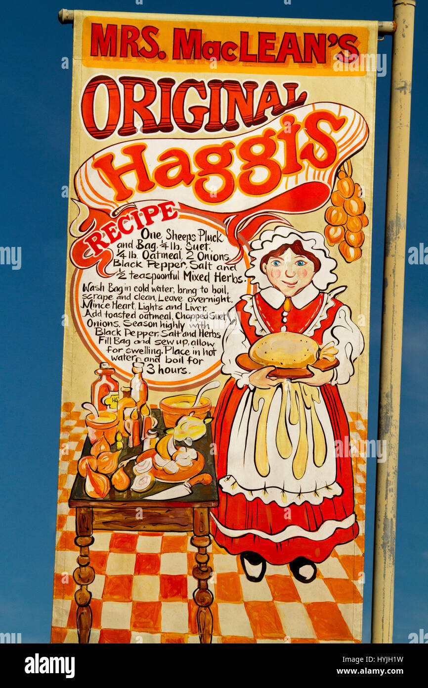 Colourful red, yellow, and white sign with woman in traditional dress and Scottish haggis recipe on display in street at Maclean, NSW Australia Stock Photo