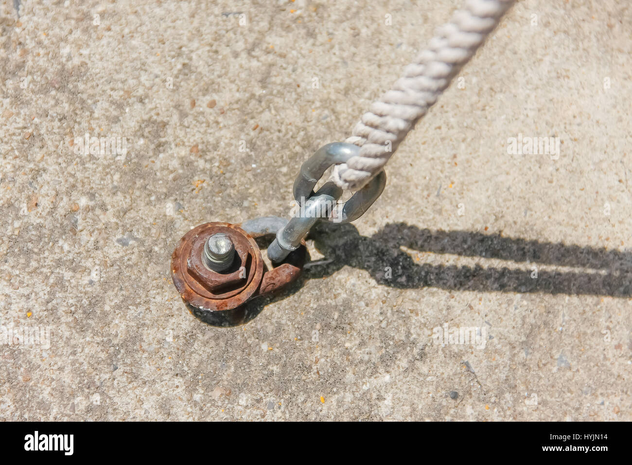 strong chain fastened with cement with nut and connect to rope Stock ...