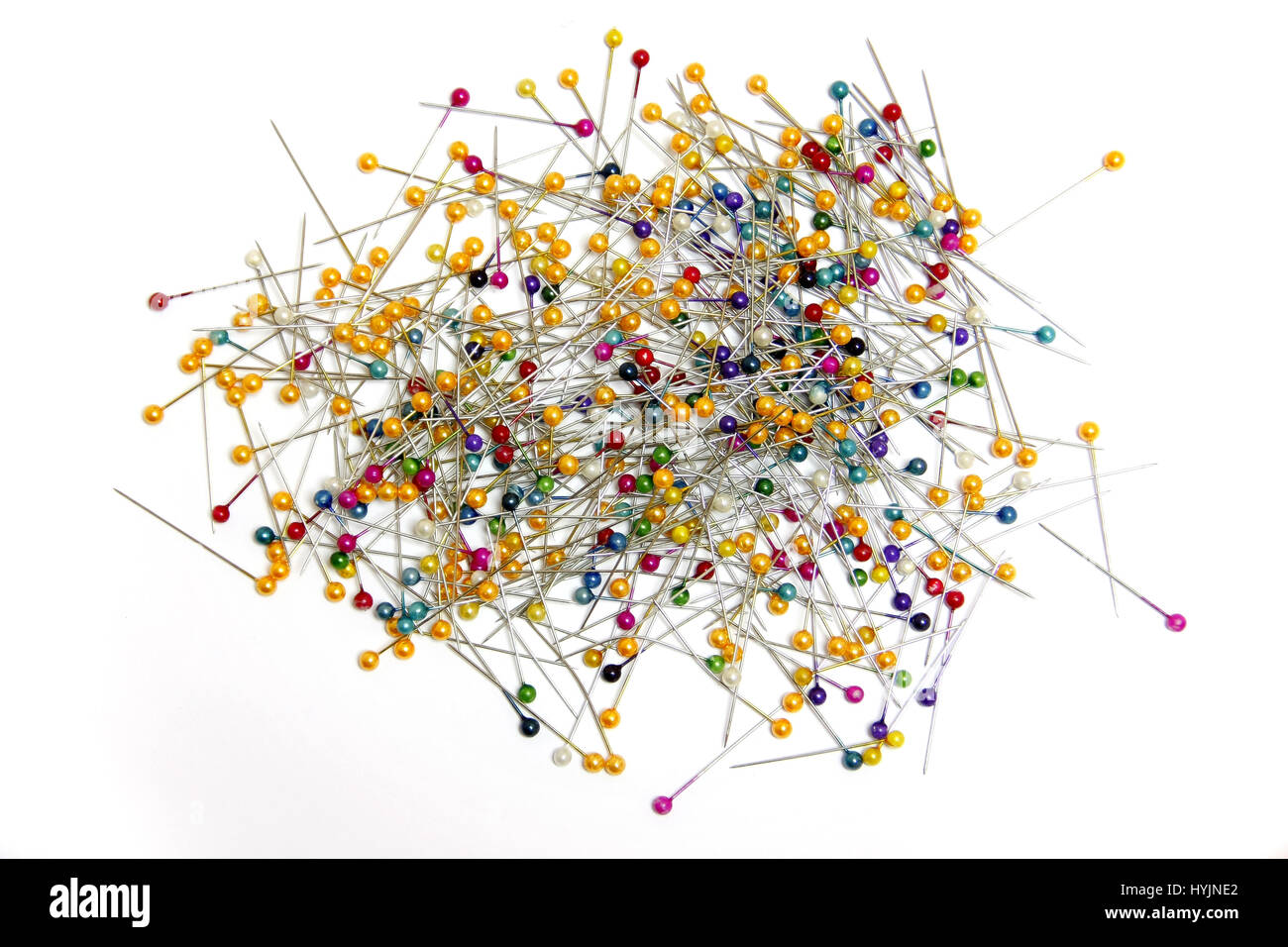 colorful many pins on white background Stock Photo - Alamy