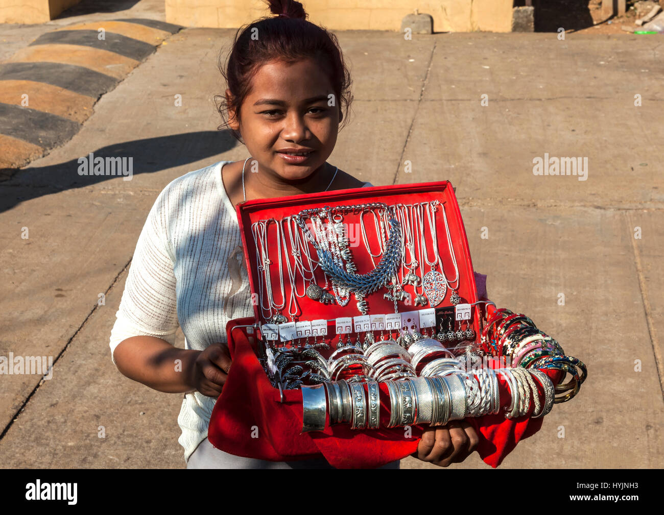 Young Cambodian girl selling trinkets at Buddhist Monastery in Oudong, Kampong Speu Province, Cambodia Stock Photo
