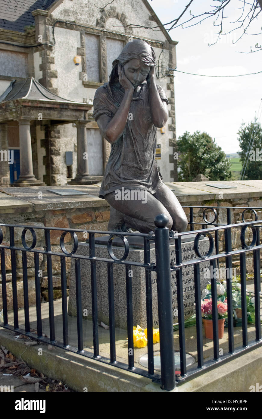 Bronze memorial statue of a girl commerating the victims of the 1972 'Bloody Monday' bomb blast which killed nine in the village of Claudy. Stock Photo