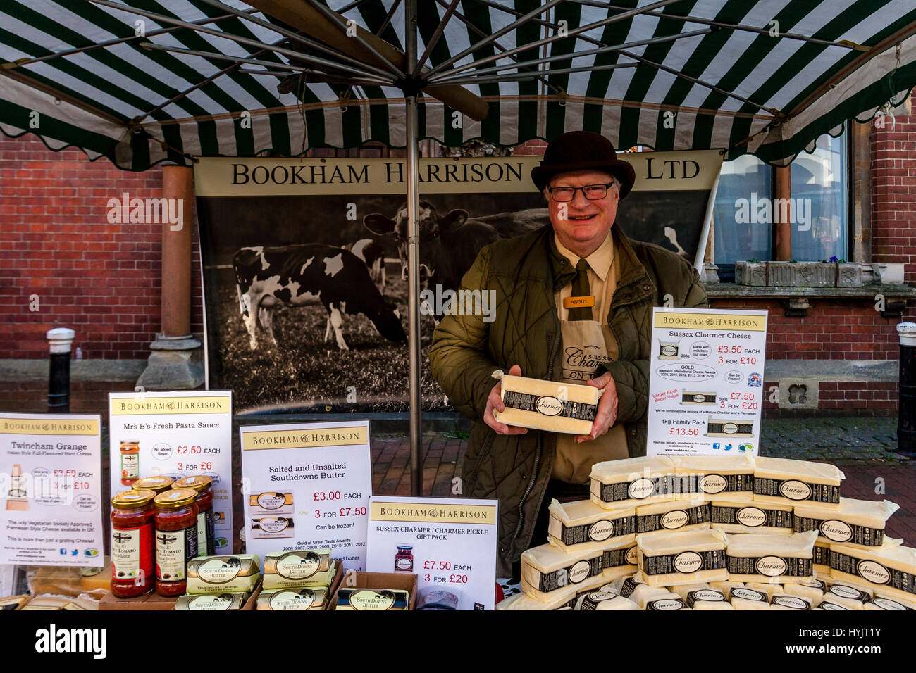 A Man Selling Dairy Products At The Saturday Farmers' Market, Lewes, Sussex, UK Stock Photo
