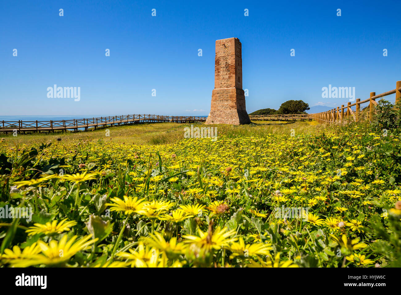 Los Ladrones moorish tower, wooden footpath, Natural Monument Dunas de Artola o Cabopino, Marbella. Malaga province Costa del Sol. Andalusia Southern  Stock Photo