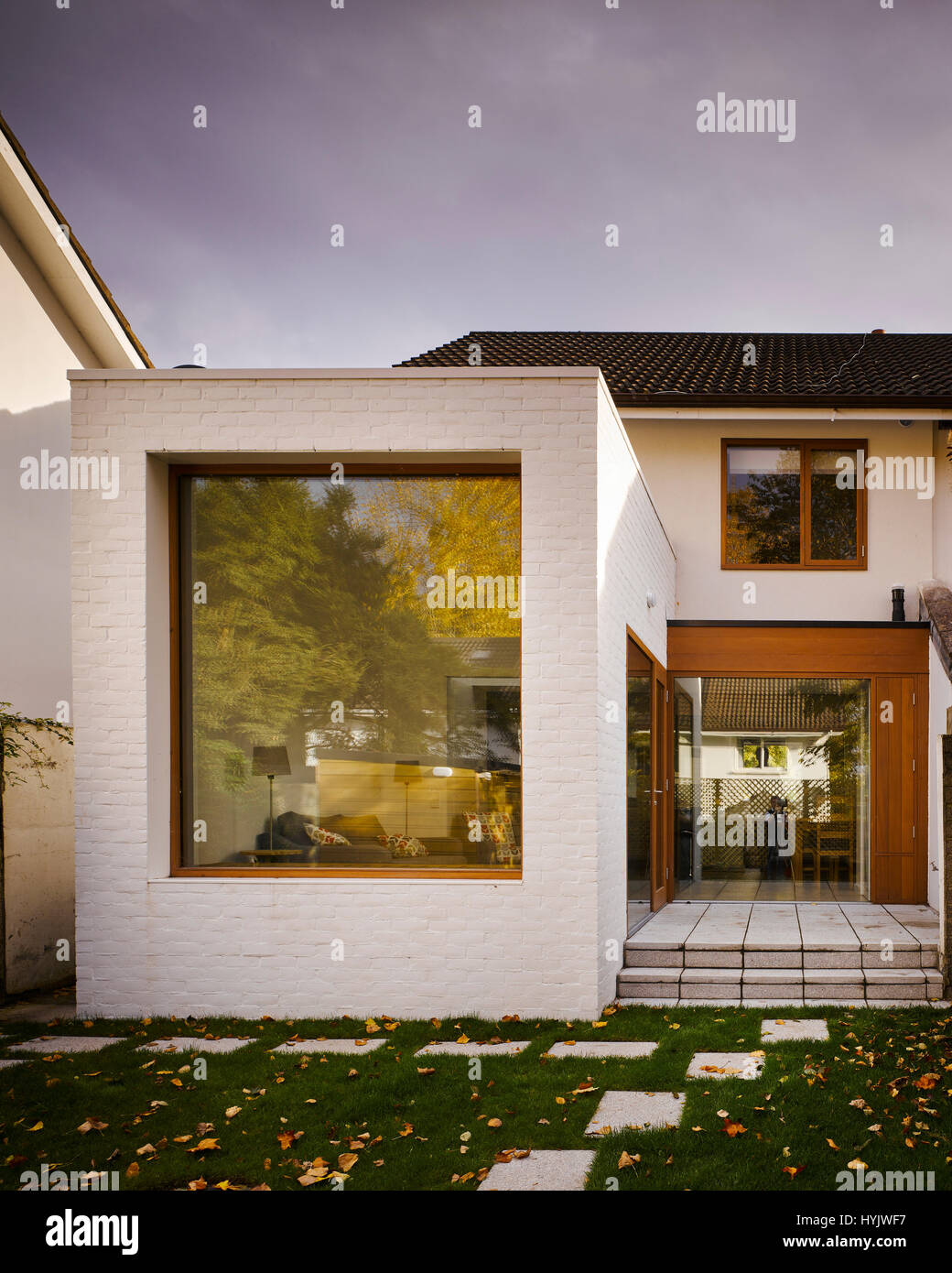 Exterior view of extension showing window and glass doors. Extension to