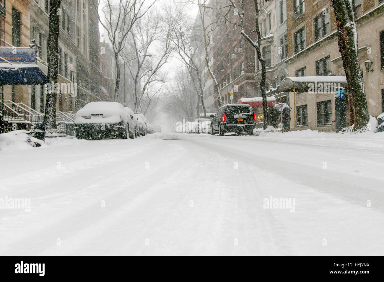 New York City residential street during a snowfall. Stock Photo
