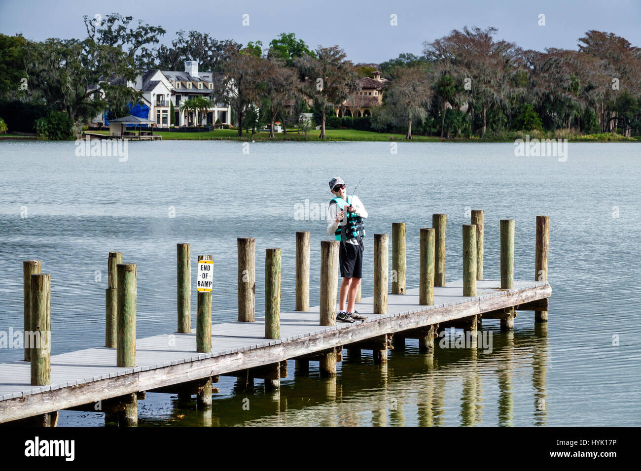 Winter Park Florida,Orlando,Lake Virginia,Dinky Dock Park,dock,boy boys,male kid kids child children youngster youngsters youth youths fishing,scenic, Stock Photo