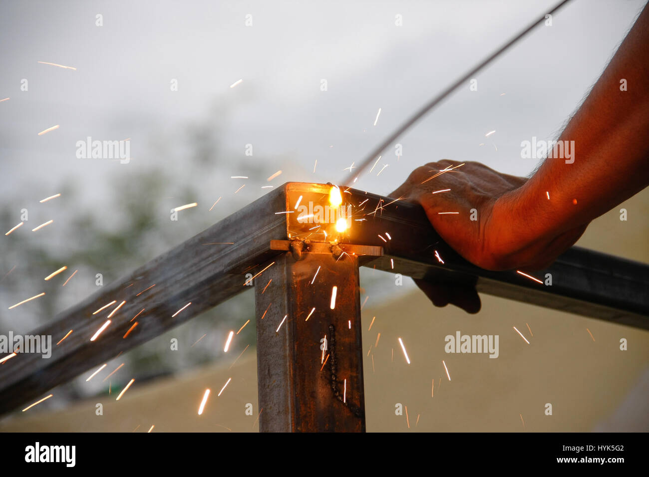 welding steel with spread spark and lighting around Stock Photo