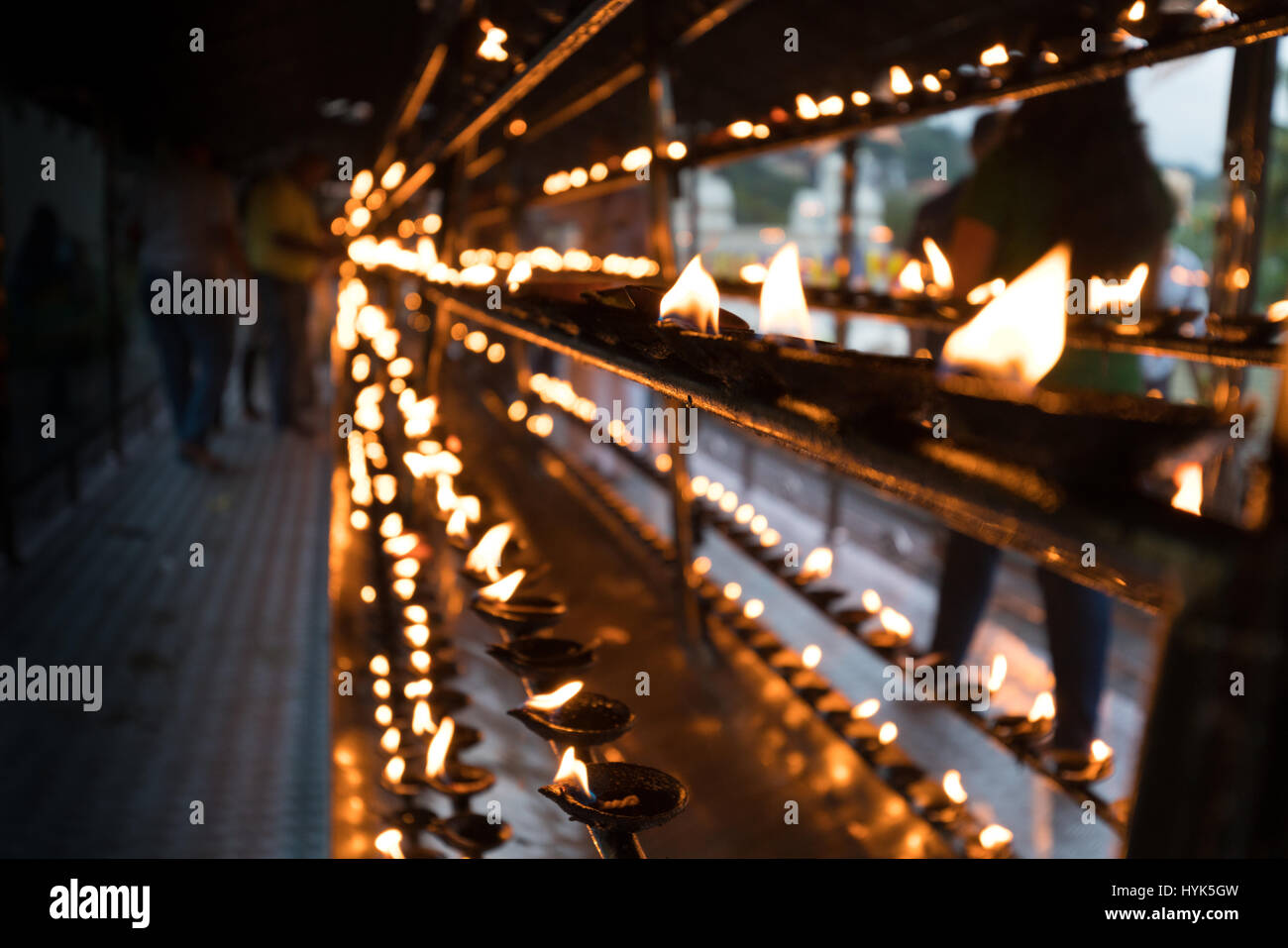 Pilgrims light up candles in the Temple of the Tooth, Sri Dalada