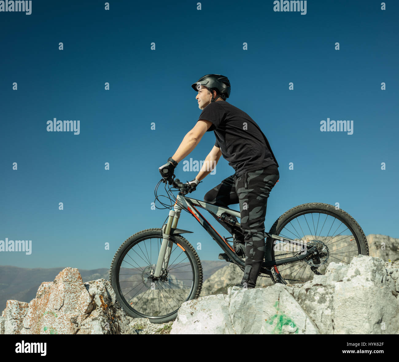 Young man with an offroad bike outdoors Stock Photo