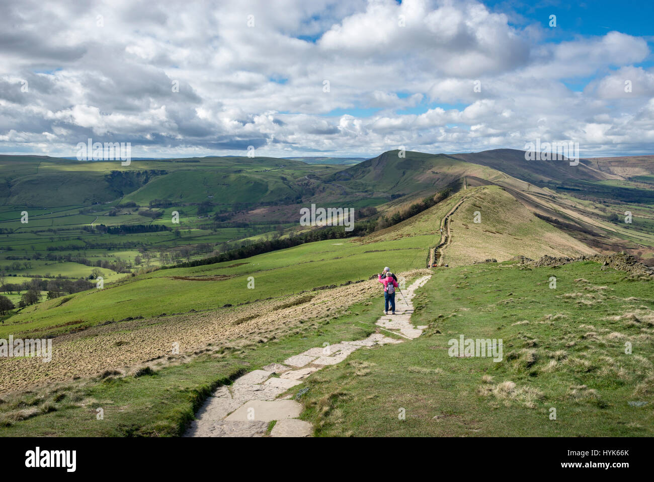 Couple walking the ridge walk from Lose Hill to Mam Tor in the Peak District national park, Derbyshire, England. Stock Photo