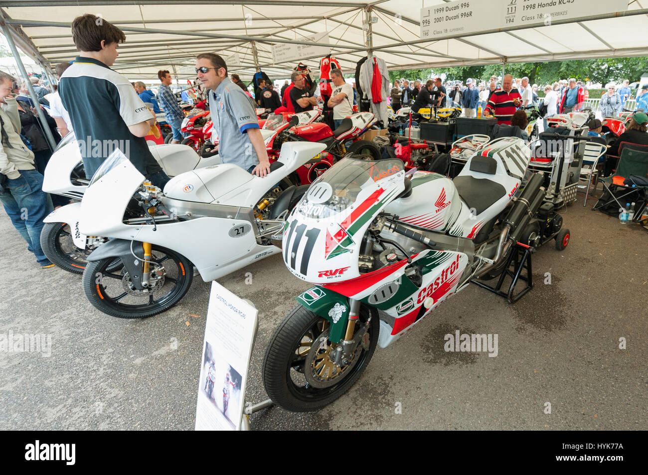 Goodwood, UK - July 1, 2012: Classic Honda and Ducati racing bikes in the service pits at the Festival of Speed motor-sport event held at Goodwood, UK Stock Photo