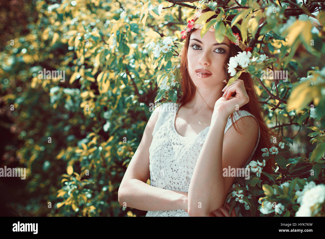 Spring flowers portrait of beautiful young woman Stock Photo