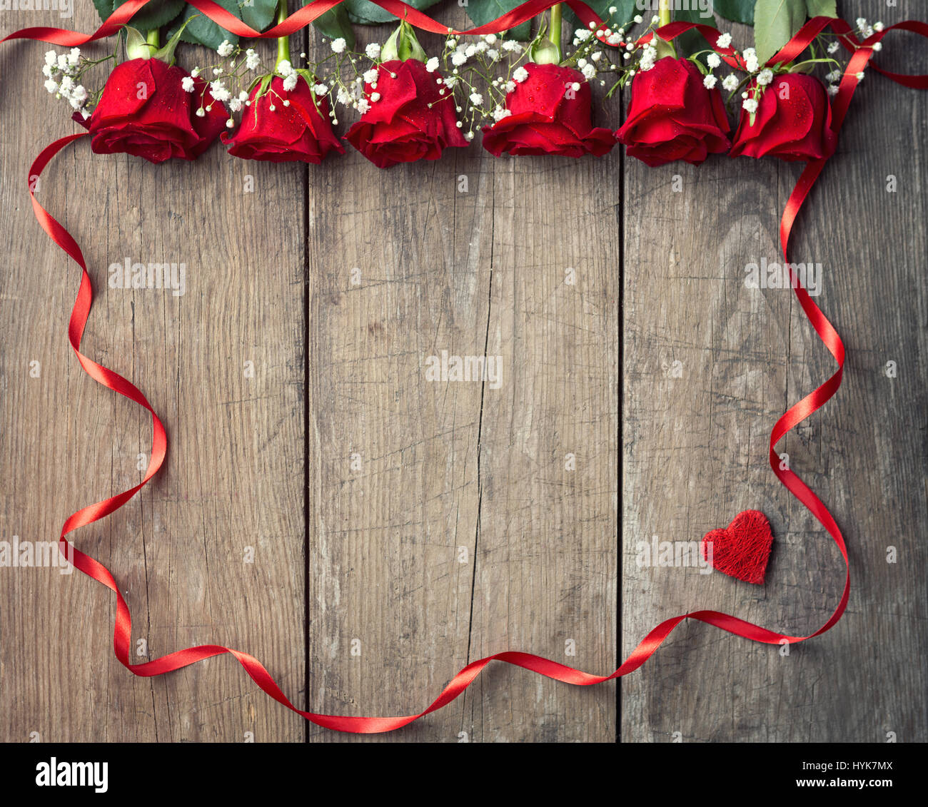 Red roses with ribbon frame background, copy space Stock Photo - Alamy