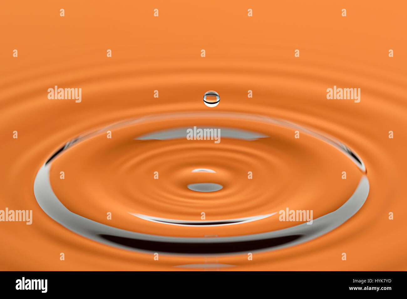 A water drop causes a ripple in this abstract image Stock Photo Alamy