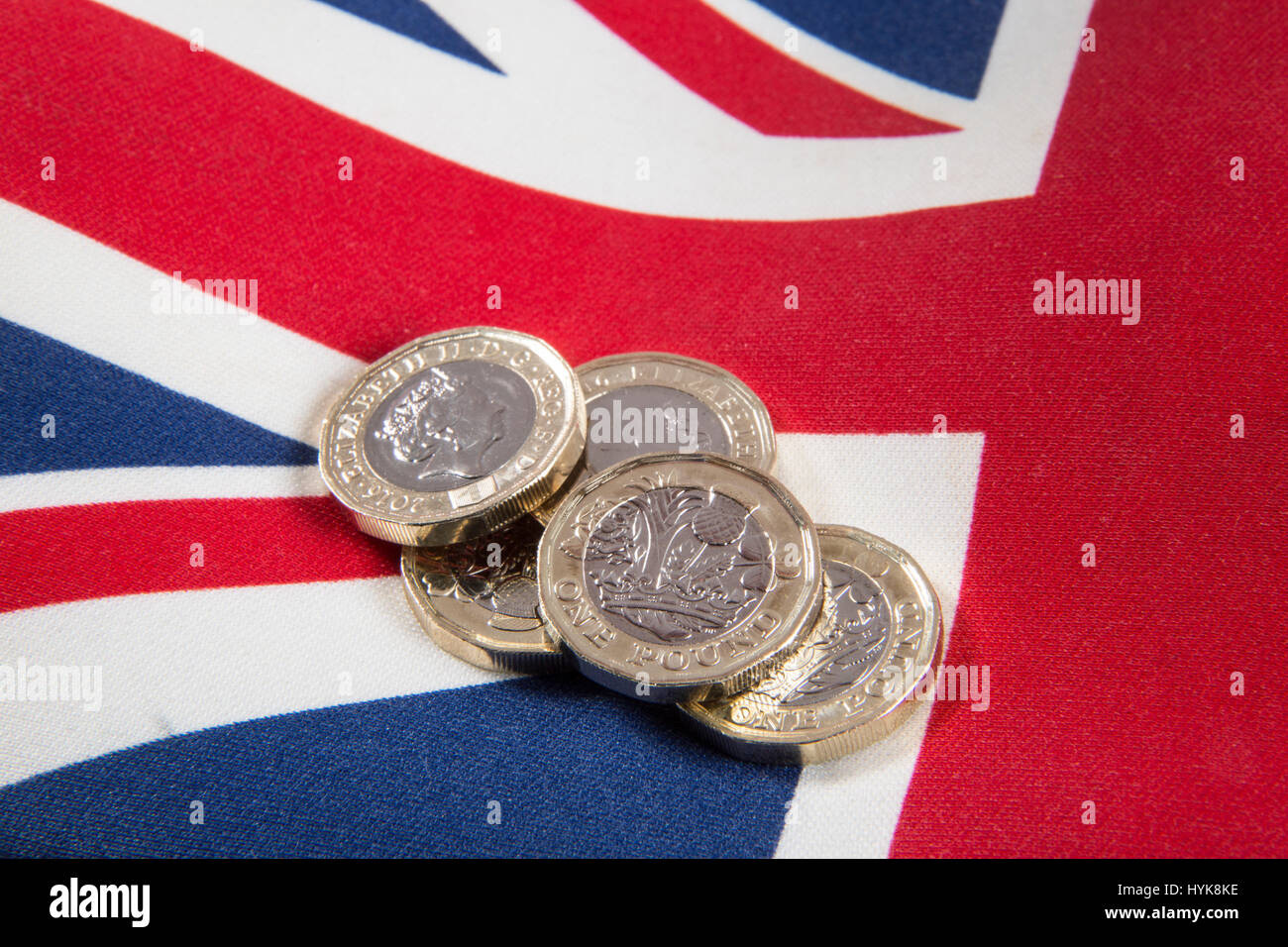 New 2016 £1 pound coins placed on a Union Jack flag Stock Photo