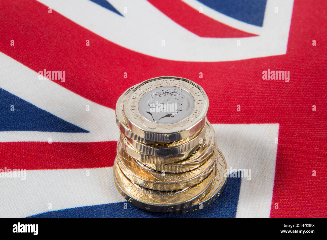 New 2016 £1 pound coins placed on a Union Jack flag Stock Photo