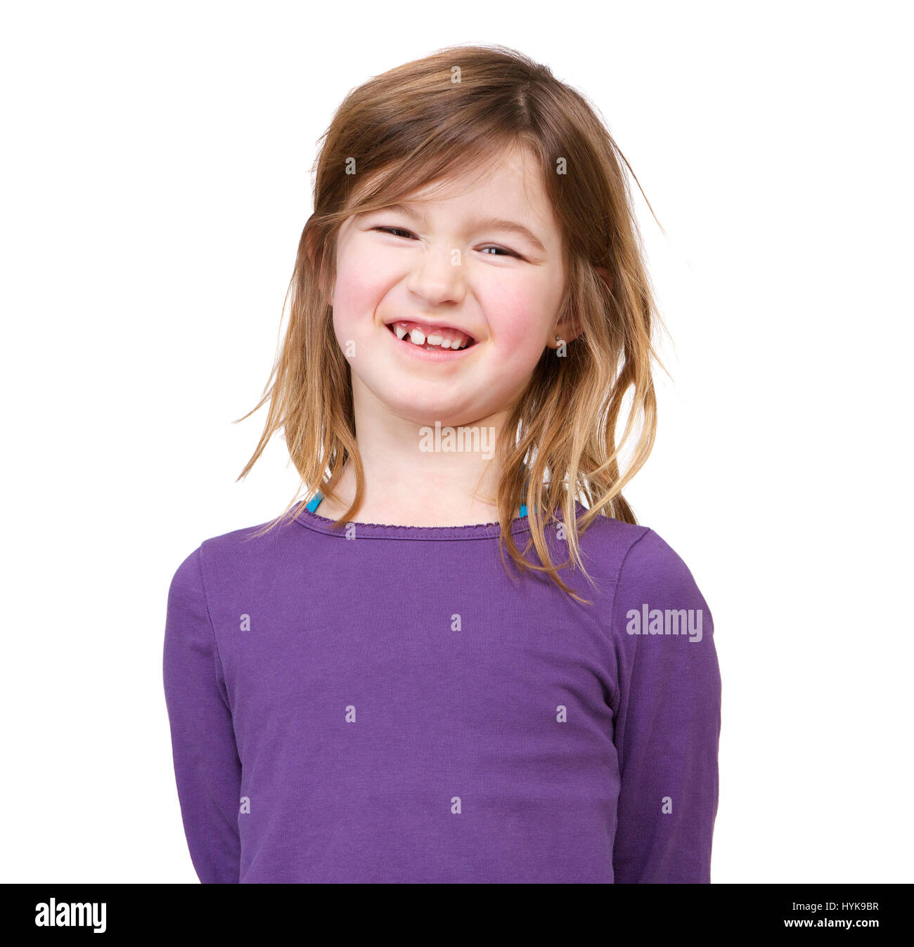 Close up portrait of a smiling young girl isolated on white background ...