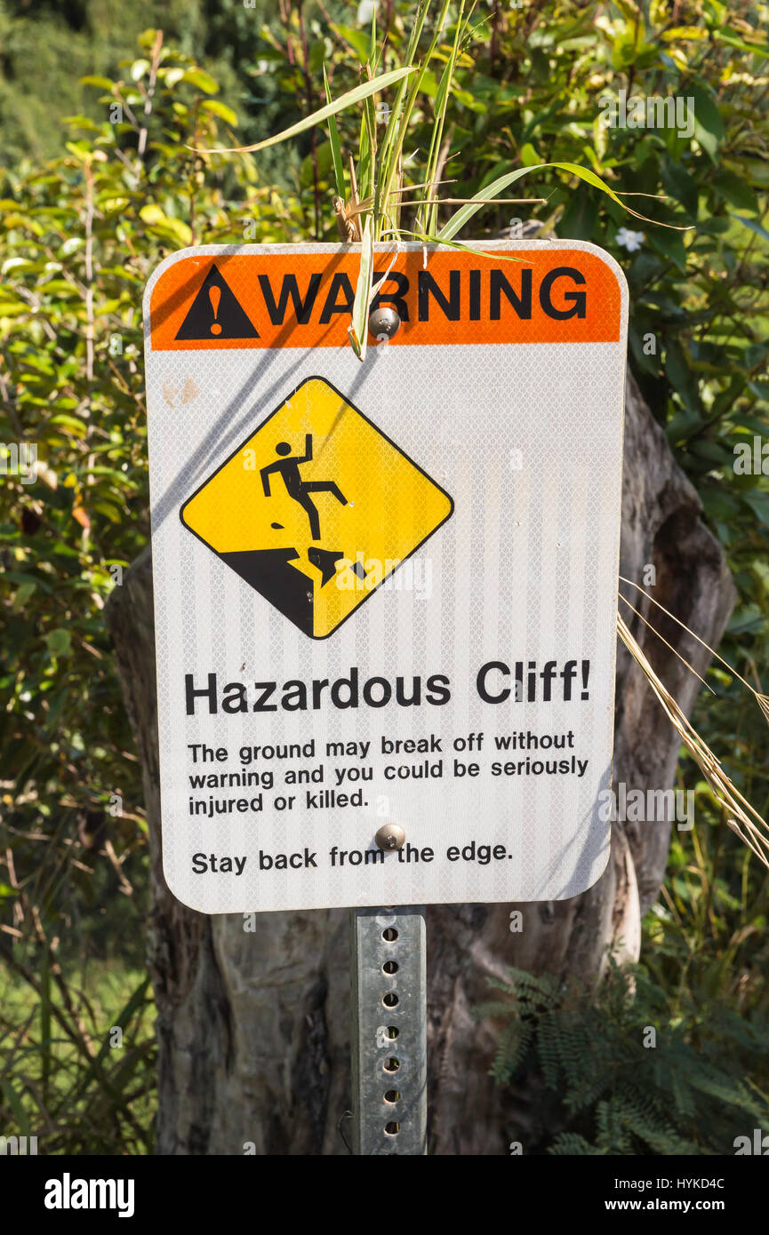 Hazardous cliff, warning sign, at Wailua Falls, Kauai, Hawaii, USA Stock Photo