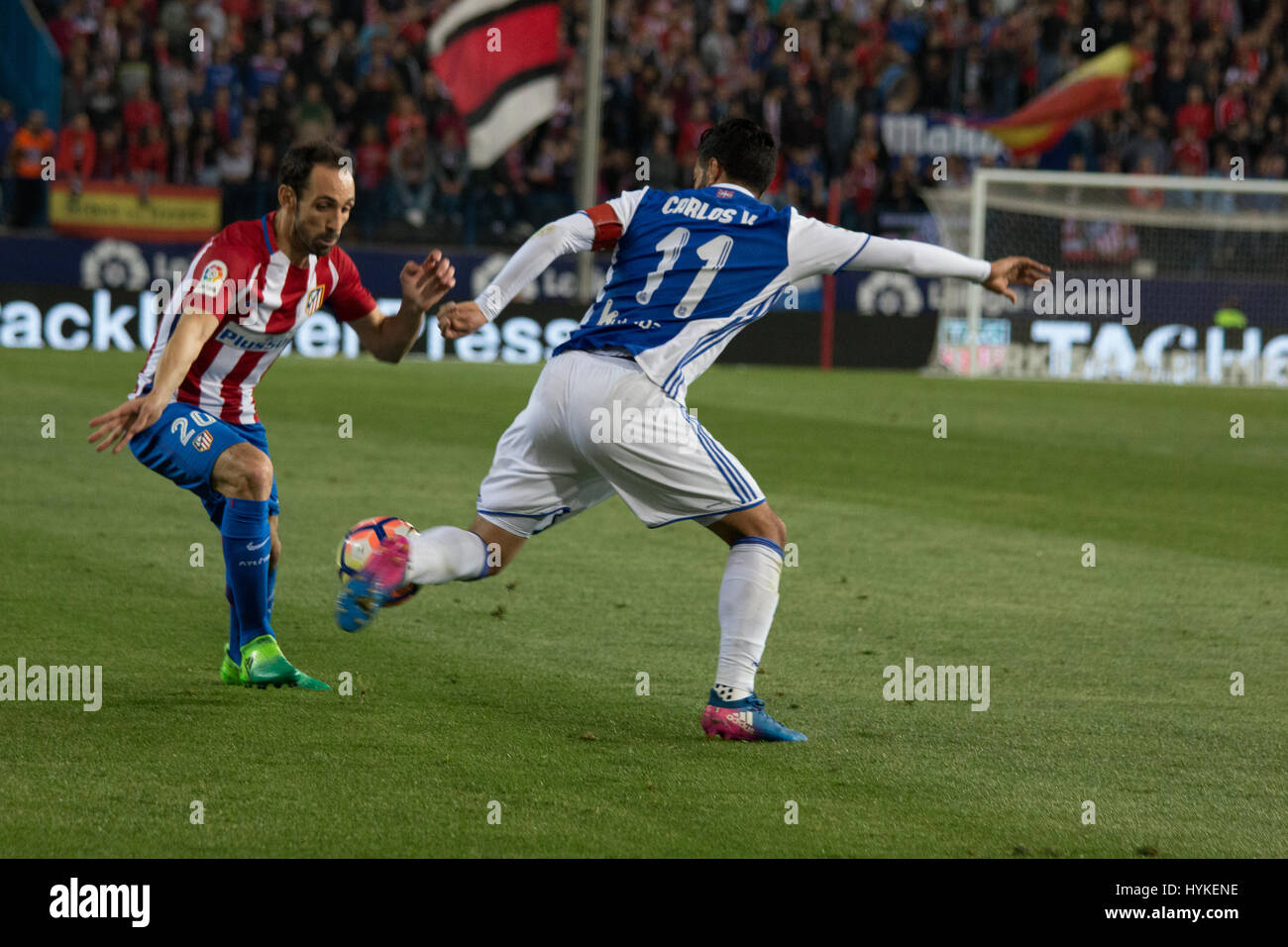 Carlos Vela (R) bloks the dribling of Juanfran (L) during the match between Atletico de Madrid and Real Sociedad. At.Madrid won over Real Sociedad with 1-0. (Photo by: Jorge Gonzalez/Pacific Press) Stock Photo