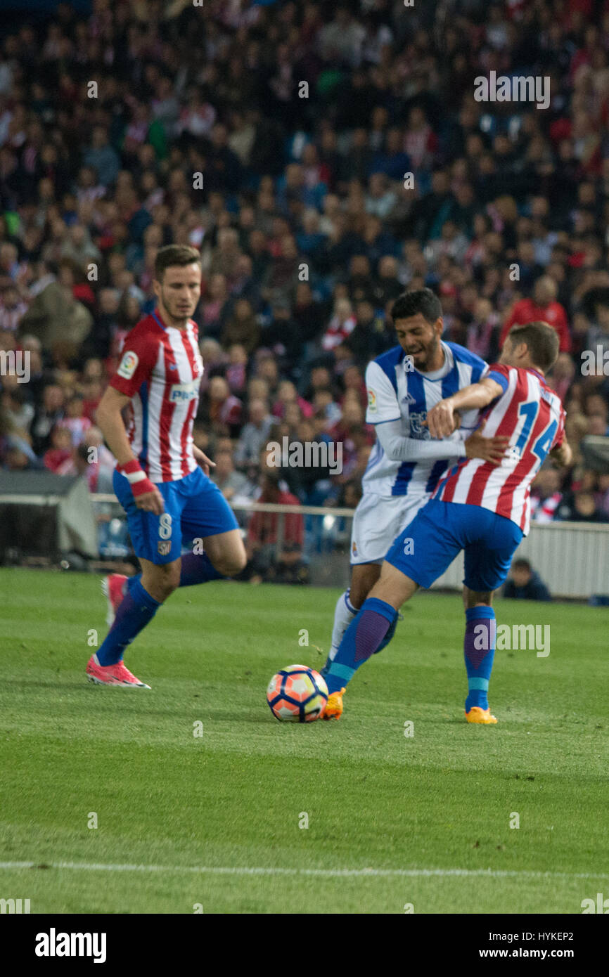 Gabi (R) makes a fault over Carlos Vela (C) meanwhile Saul (L) looks during the match between Atletico de Madrid and Real Sociedad. At.Madrid won over Real Sociedad with 1-0. (Photo by: Jorge Gonzalez/Pacific Press) Stock Photo