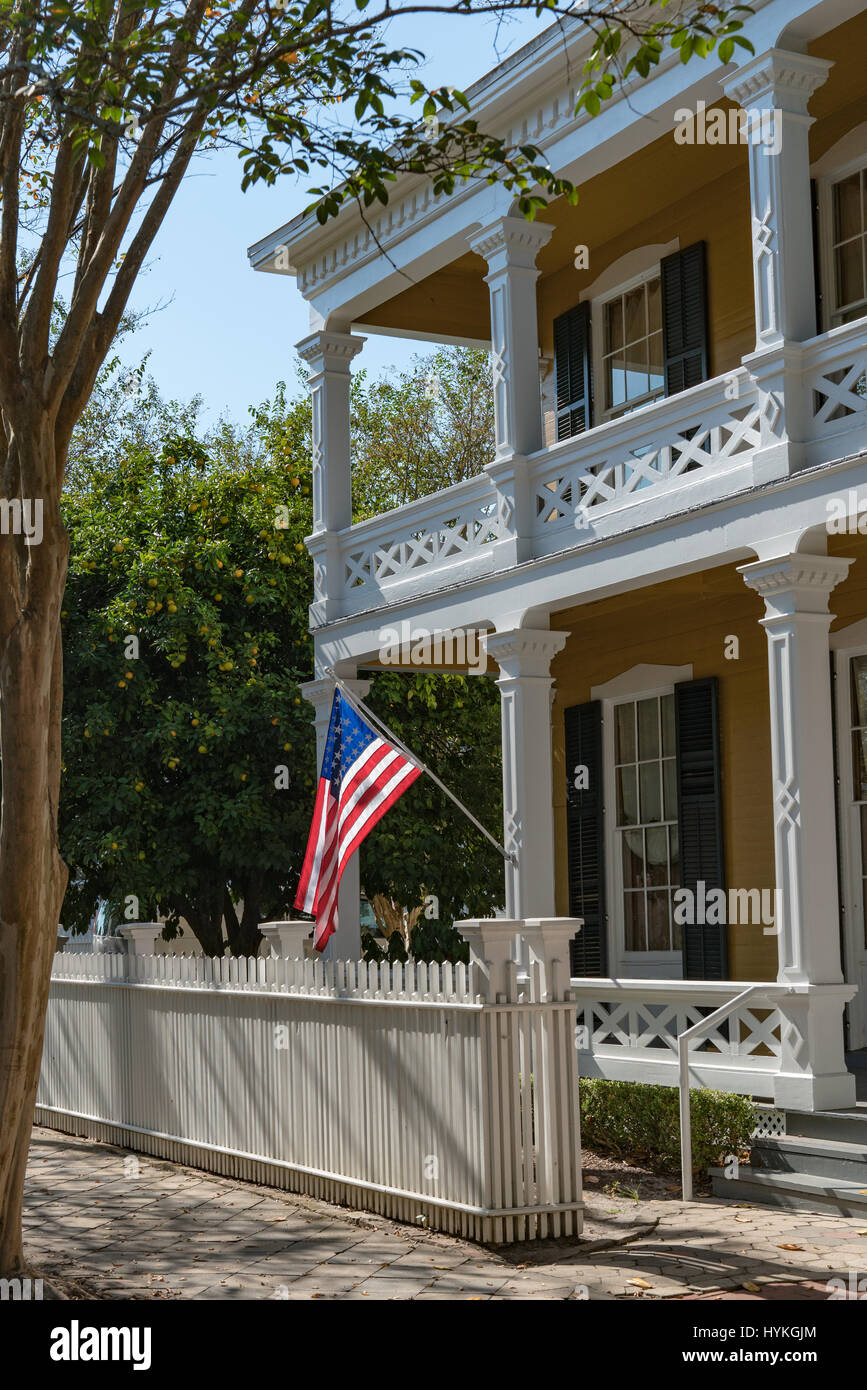 The sun catches the US Flag on the Dorr House, Pensacola, Florida Stock Photo