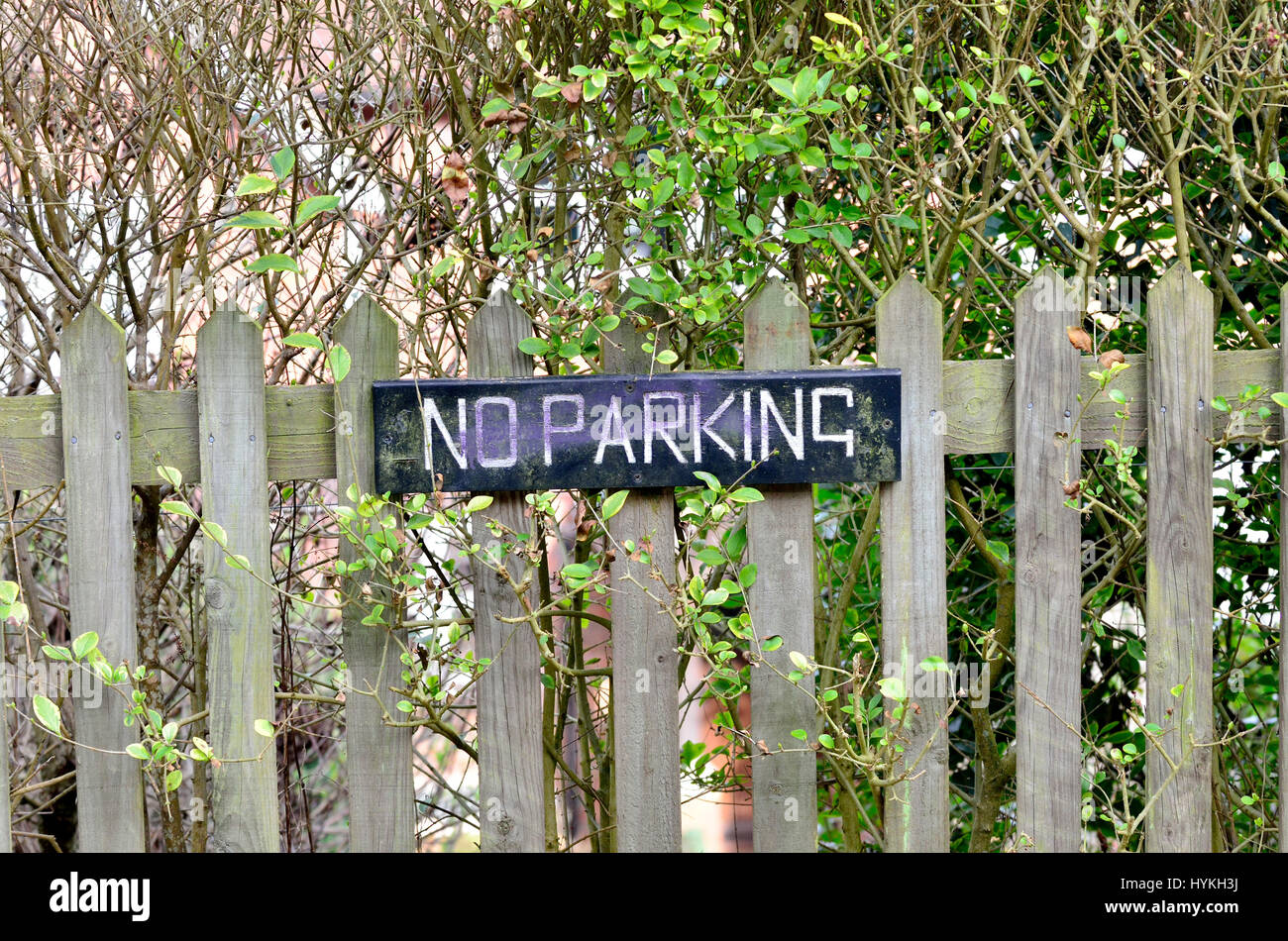 No Parking sign on a garden fence. Loose Village, Kent, England. Stock Photo