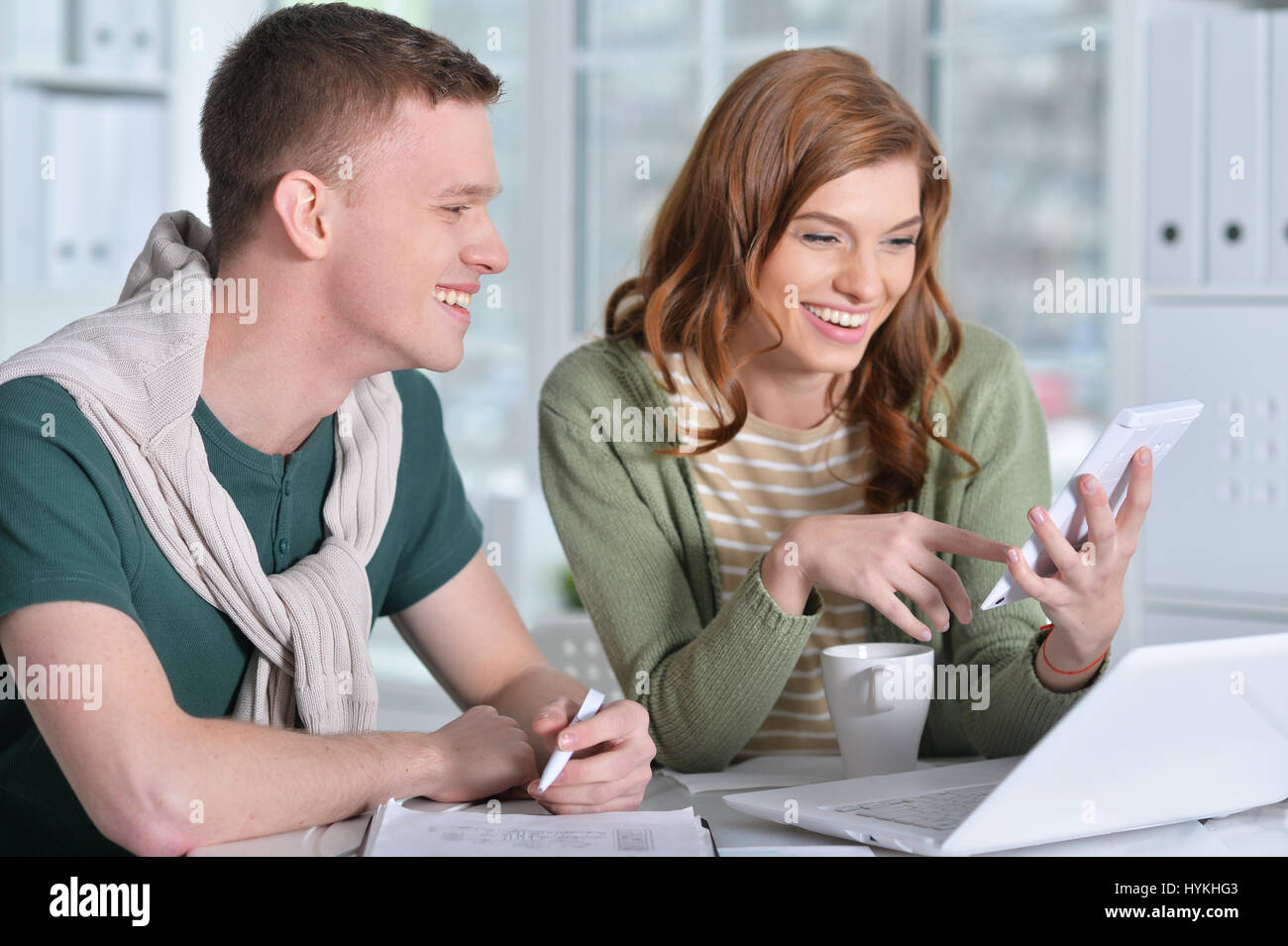 Beautiful young couple with a laptop Stock Photo - Alamy