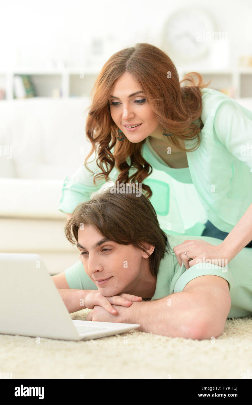 Beautiful young couple with a laptop Stock Photo - Alamy