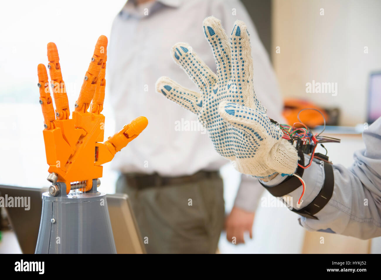 Controlling Robotic Hand With Remote Glove Stock Photo