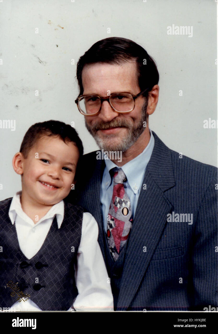 Houston, Texas, USA: A picture of Tiamat's late partner Mark Phillips and son Marcos Hernandez as a child, pictured in June 2002. WELCOME to the world of the transgender former banker who claims to be the first and only person to have both ears cosmetically removed as part of her quest to become a DRAGON.  Born Richard Hernandez in Mobiltown, Maricopa County, Arizona, this fifty-five-year-old would-be dragon now known as “Tiamat” has taken on several personas and undergone multiple stages of transformations or ‘metamorphosis’ to arrive at her final reptilian destination. This “human-dragon” al Stock Photo