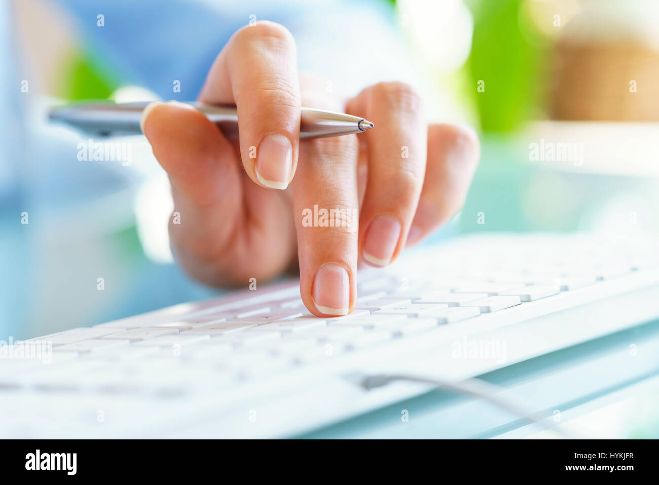 Hands or woman office worker typing on the keyboard Stock Photo