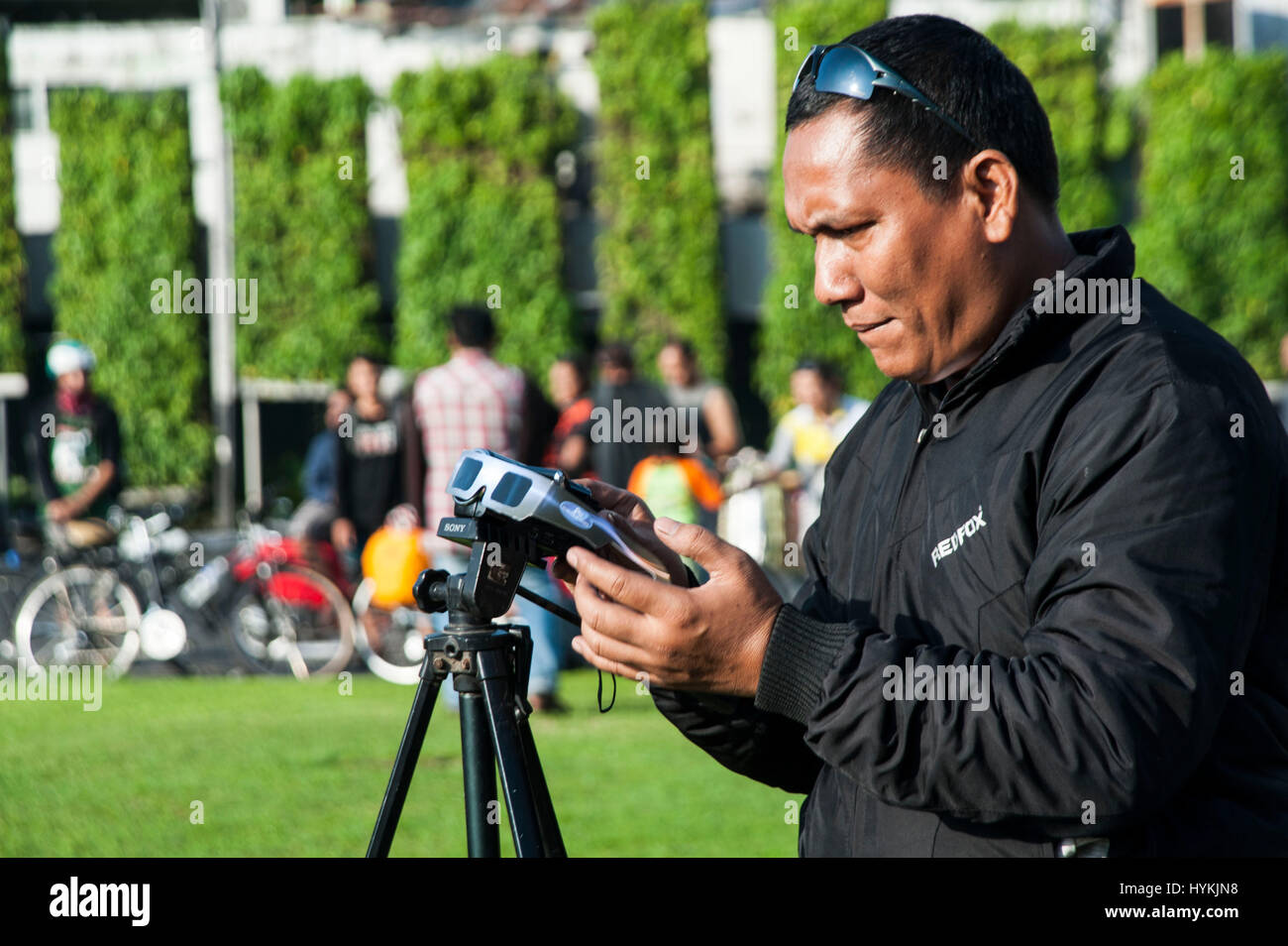 JAKARTA, INDONESIA MARCH 08 An Indonesian Man record a solar