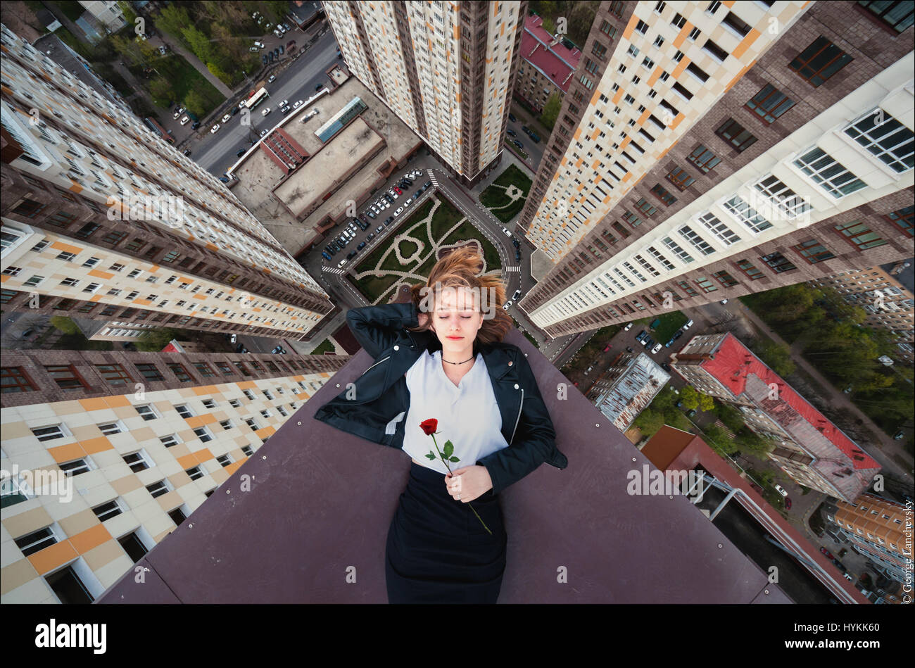 Moscow. VERTIGO inducing pictures from the top of a 155-foot-high crane have been captured by a photographer in bid to overcome his fear of heights. The amazing aerial images show the photographer and his friends throw caution to the wind as they precariously perch high above the cities with no safety equipment. Other shots capture the adventurous bunch in the middle of climbs up cranes and beautiful women posing on the edge of roof tops. The extreme photos were taken by Moscow photographer and acrophobic George Lanchevsky (24) in cities around the world including Moscow, Galich and Hong Kong. Stock Photo