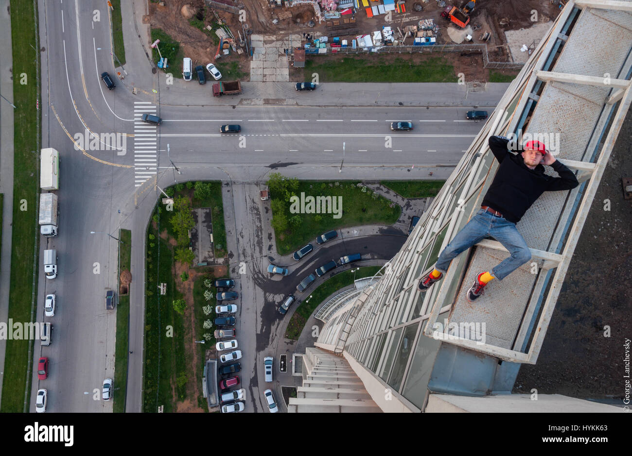 Moscow. VERTIGO inducing pictures from the top of a 155-foot-high crane have been captured by a photographer in bid to overcome his fear of heights. The amazing aerial images show the photographer and his friends throw caution to the wind as they precariously perch high above the cities with no safety equipment. Other shots capture the adventurous bunch in the middle of climbs up cranes and beautiful women posing on the edge of roof tops. The extreme photos were taken by Moscow photographer and acrophobic George Lanchevsky (24) in cities around the world including Moscow, Galich and Hong Kong. Stock Photo