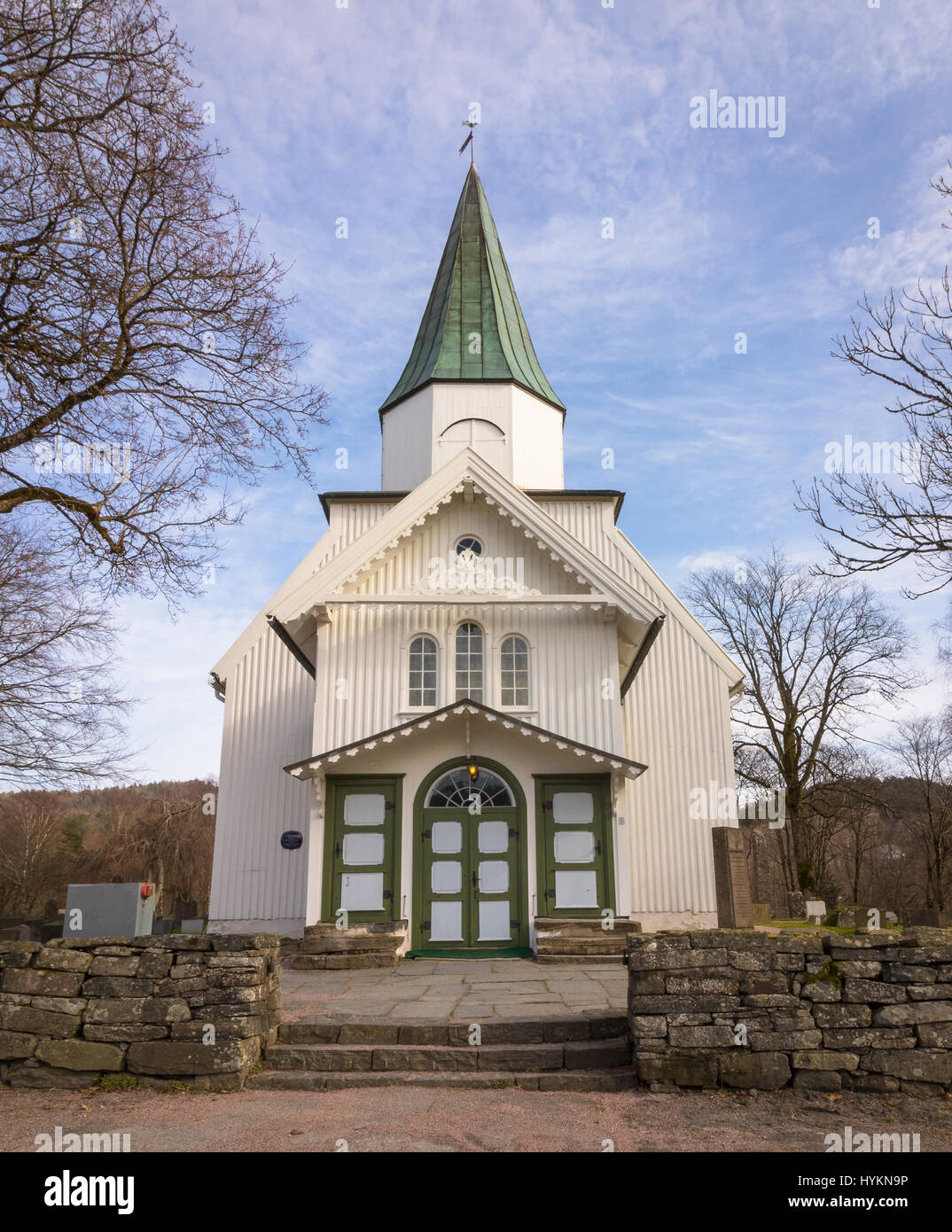 White church and blue sky with small clouds in Norway, vertical image Stock Photo