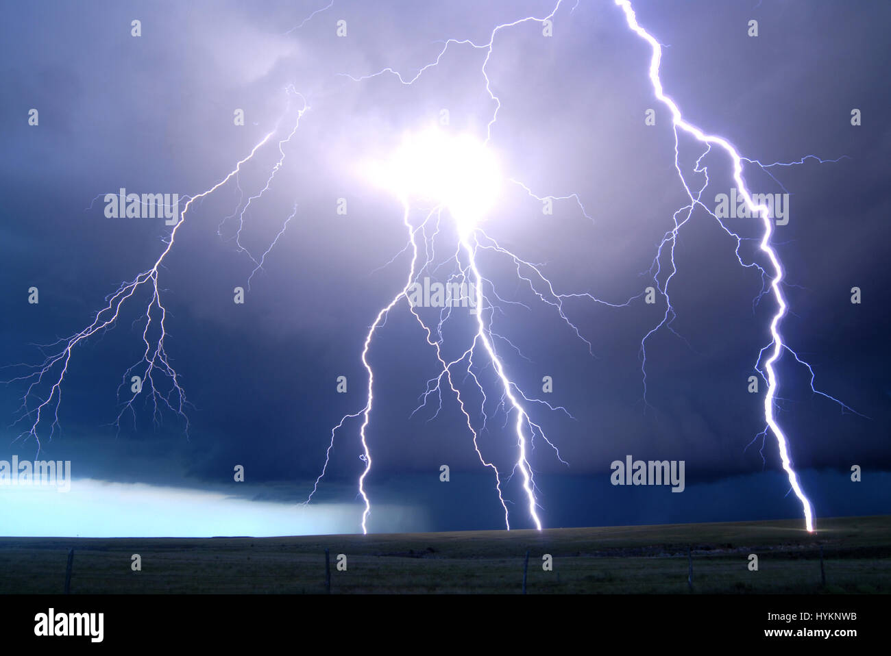 TORNADO ALLEY, USA: Texas, dual postive flash lighning. THE DEADLIEST weather events have been captured on camera by one lightning quick photographer. Incredible photographs show extreme weather from America’s Tornado Alley, renowned for the frequency of its storms. From terrifying lightning bolts to all-encompassing tornados, these pictures manage to capture to ferocity and atmosphere of these natural phenomena. Stock Photo