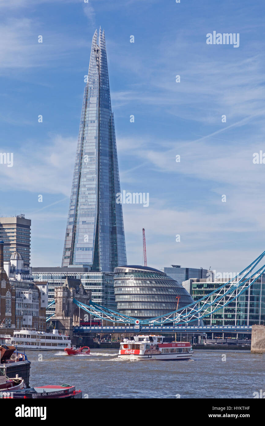 A view from The Thames Upper Pool, looking upstream towards Tower Bridge, City Hall and the Shard Stock Photo