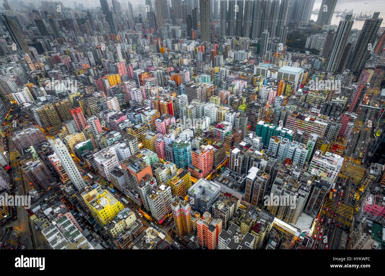 HONG KONG, CHINA: AERIAL shots taken by a drone from one thousand six hundred and forty feet in the air show the incredible clusters of skyscrapers in what is one of the world’s most dense cities. Pictures reveal a distinct lack of green space among the high concentration of multi-coloured tower blocks looking like concrete spikes darting out from the surface at varying heights. Closer inspection reveals roof gardens and connecting road networks weaving throughout the giant structures.  Other pictures show the China, DJI Phantom 3 Professional drone used to capture these airborne images. Photo Stock Photo