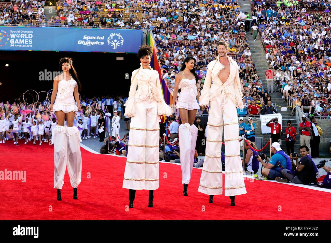 Performers on stilts at the Special Olympics World Games Opening Ceremony at the Coliseum on