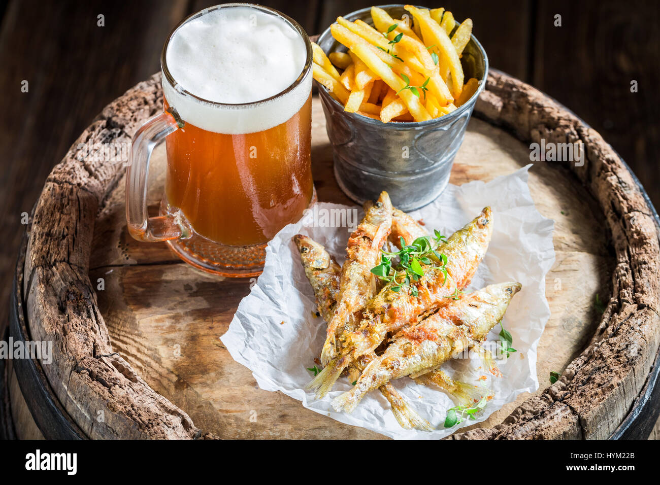 Homemade smelt fish and chips with salt and herbs Stock Photo