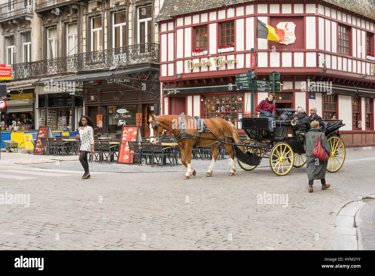 Tourists with a horse carriage visit the city Stock Photo