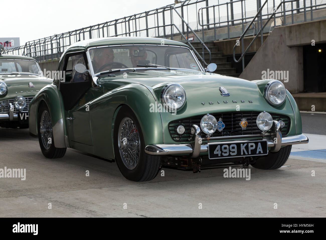 A Green, 1959 Triumph TR3  Sports Car, in the International Pit lane, during the Silverstone Classic Media Day Stock Photo