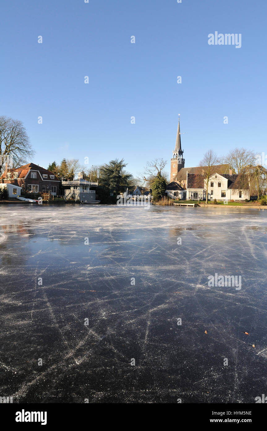 a frozen lake in the village Broek in Waterland, the Netherlands Stock Photo