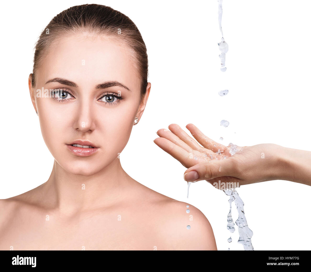 Woman face and pouring water in hand. Stock Photo