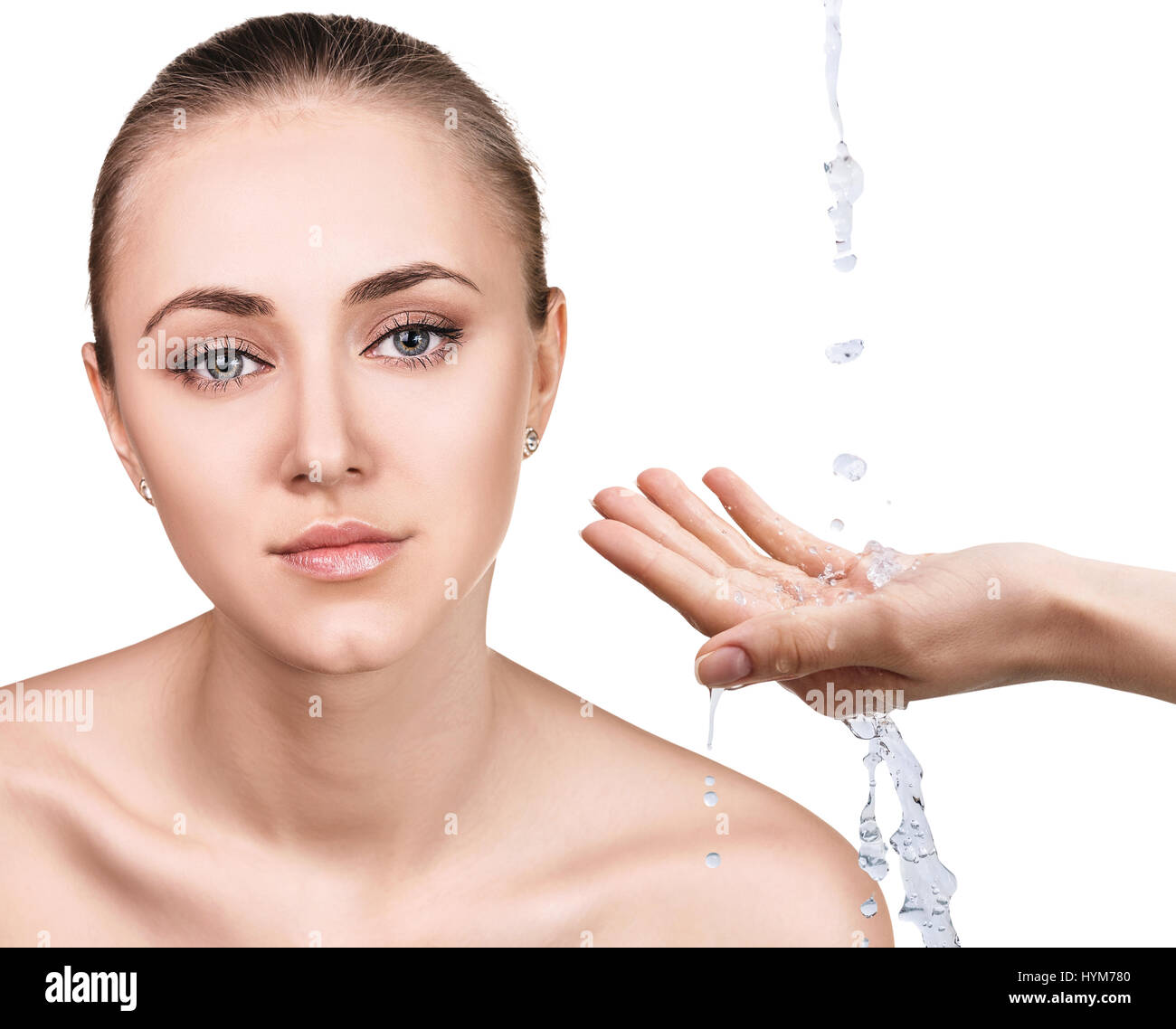 Woman face and pouring water in hand. Stock Photo