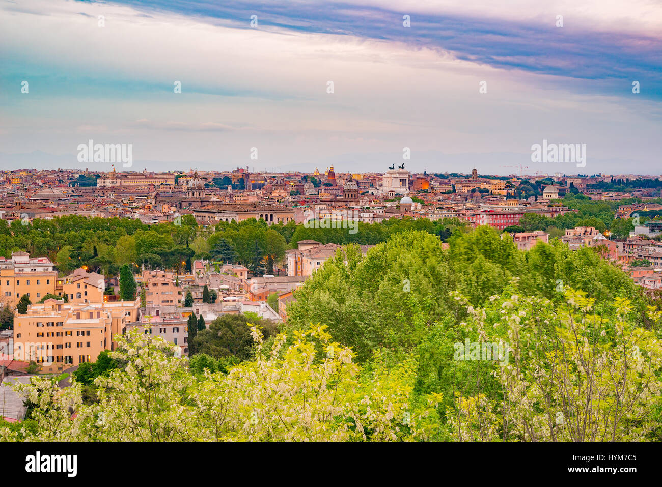 Rome, Italy, at dusk. Panoramic cityscape from above with cross processing filter applied. Stock Photo