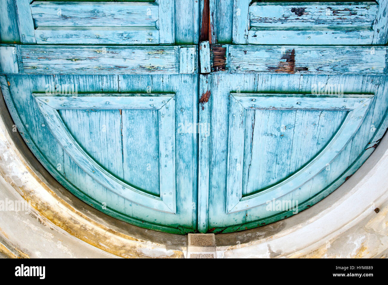 abstract  rusty brass brown knocker in a   closed wood door carnago varese italy Stock Photo