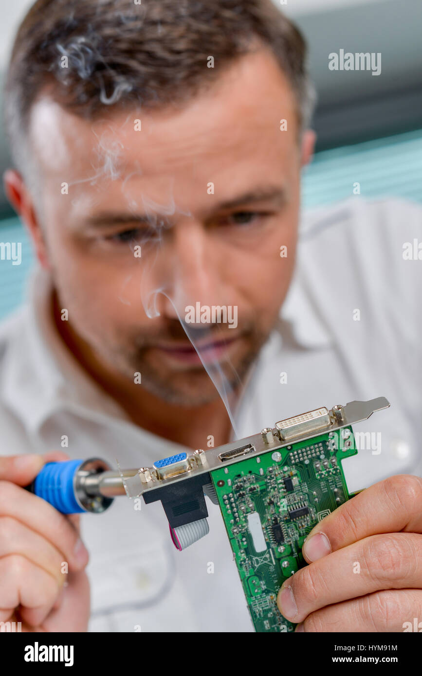 Soldering a video card Stock Photo Alamy