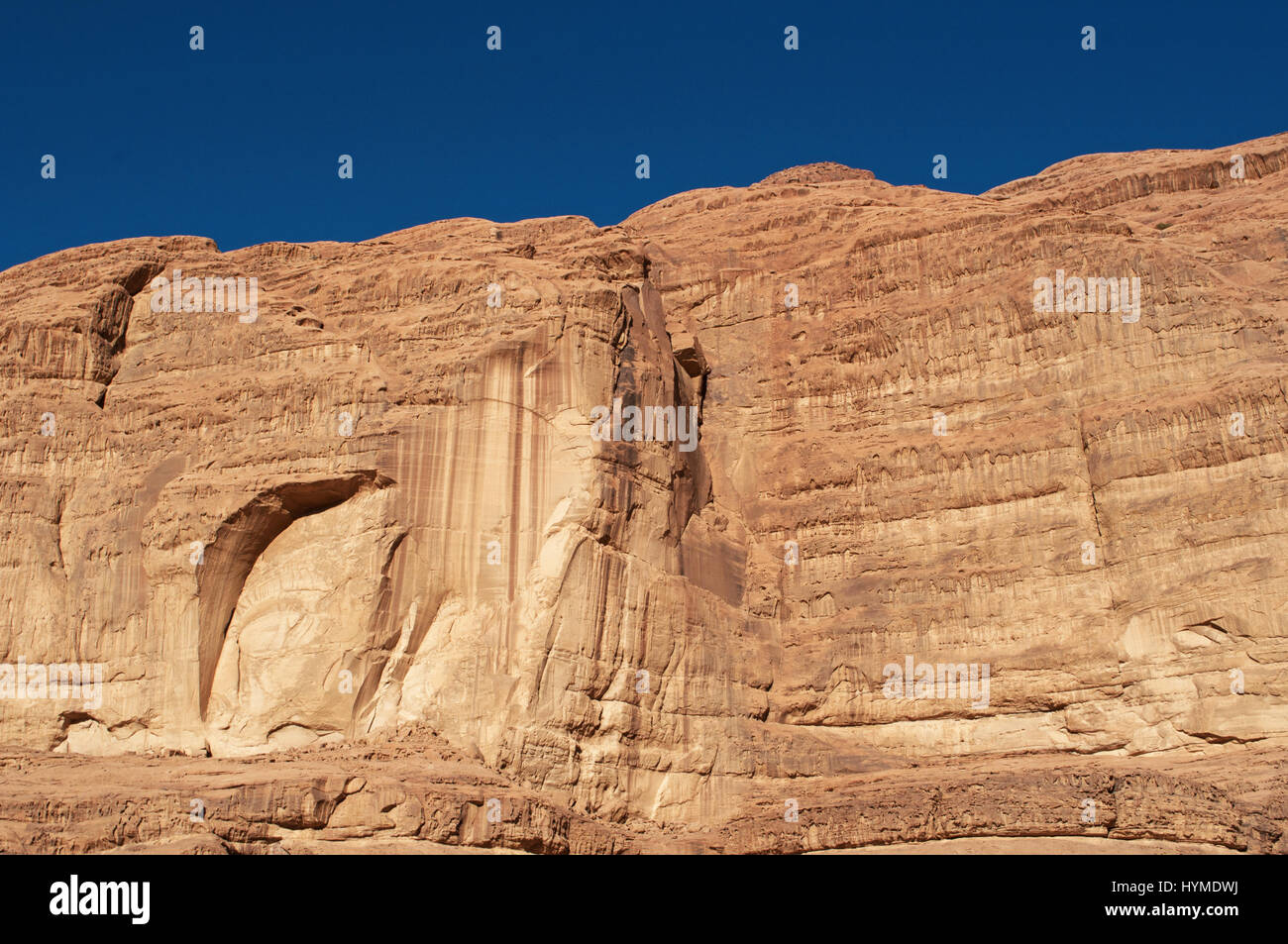 Jordanian rocks in the desert of Wadi Rum, Valley of the Moon, a valley cut into the sandstone and granite rock and looking like the planet of Mars Stock Photo